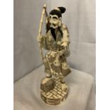 A TALL CARVED BONE JAPANESE MAN FIGURINE