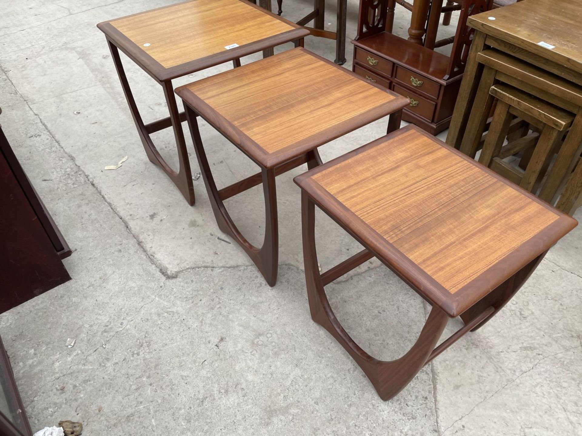 A RETRO TEAK NEST OF THREE G-PLAN TABLES