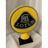 A LARGE CAST LOTUS SIGN ON A WOODEN BASE H:51CM