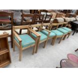 A SET OF SIX PINE FRAMED DINING CHAIRS, TWO BEING CARVERY