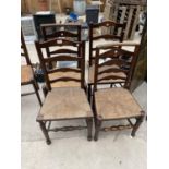 A HARLEQUIN SET OF FOUR LADDERBACK DINING CHAIRS WITH RUSH SEATS