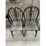 A PAIR OF WHEELBACK WINDSOR STYLE CHAIRS, BOTH STAMPED N-184