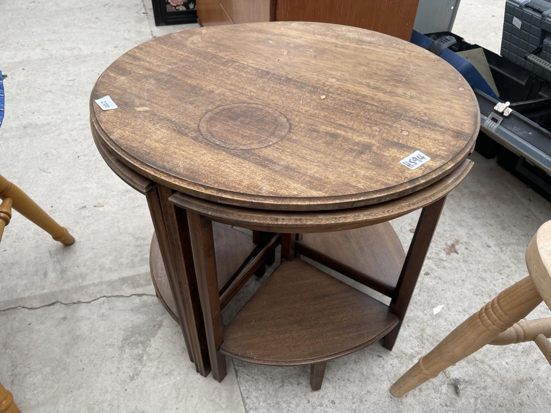 A CIRCULAR MAHOGANY NEST OF FOUR TABLES, 24" DIAMETER - Image 5 of 5