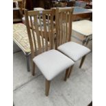 A PAIR OF MODERN OAK DINING CHAIRS