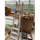 A VINTAGE 6 RUNG WOODEN STEP LADDER AND A 3 RUNG ALLUMINIUM STEP LADDER