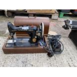 A VINTAGE SINGER ELECTRIC SEWING MACHINE