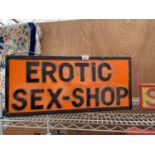 AN ILLUMINATED 'EROTIC SEX-SHOP' SIGN