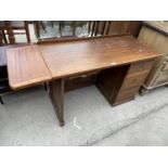 A MID 20TH CENTURY SINGLE PEDESTAL TYPISTS DESK WITH THREE DRAWERS, TWO SLIDES AND DROP-LEAF, 42.