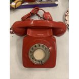 A RETRO RED DIAL UP TELEPHONE IN RED