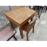 A 20TH CENTURY CHILDS DESK AND CHAIR