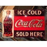 AN 'ICE COLD COCA-COLA SOLD HERE' METAL SIGN