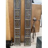 A PAIR OF TALL CAST IRON WINDOW FRAMES WITH LEADED STAINED GLASS WINDOWS (H:253CM) (SLIGHT DAMAGE TO