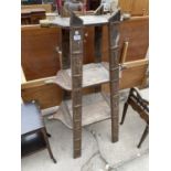 A 19TH CENTURY POSSIBLY INDIAN THREE TIER DISPLAY STAND WITH TAPERING FORM, METALWARE FRAMEWORK WITH