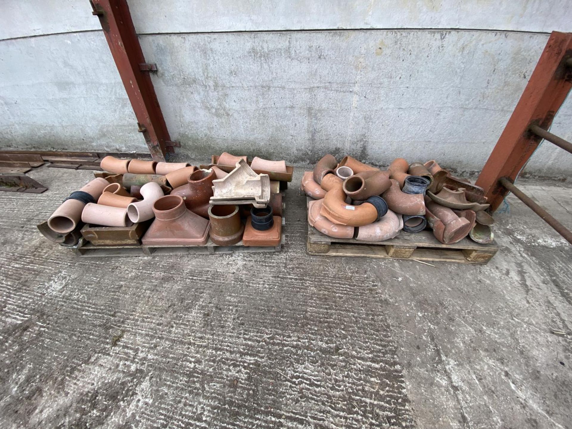 2 PALLETS OF CLAY PIPE BENDS ETC. ETC.