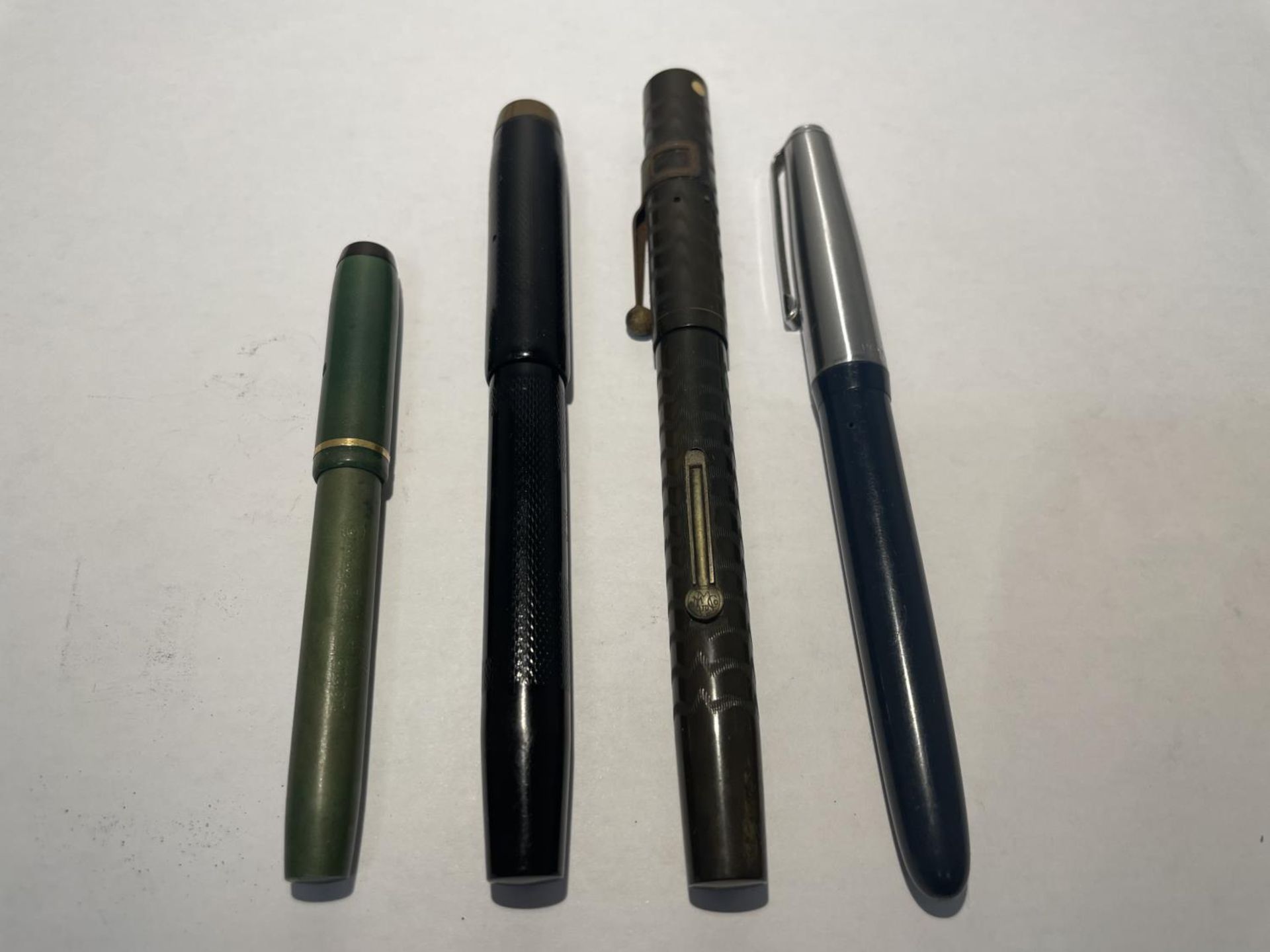 FOUR VINTAGE FOUNTAIN PENS WITH 14 CARAT GOLD NIBS - A COMBRIDGE NO 2, A CONWAY STEWART, A SPOT