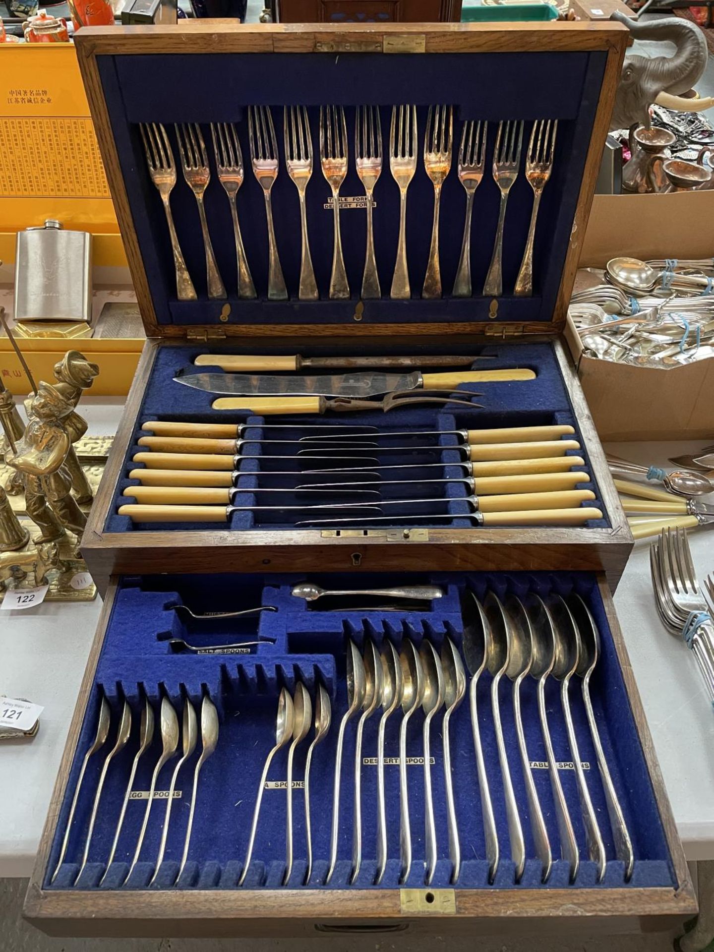 A LARGE OAK BOX WITH DRAW CONTAINING FRANK COBB & CO BONE HANDLED FLATWARE