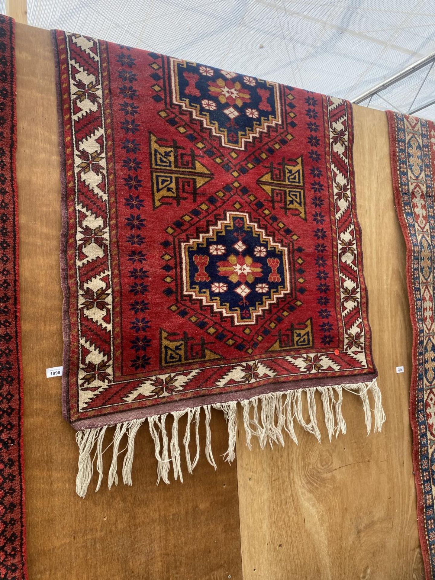 A RED PATTERNED RUG