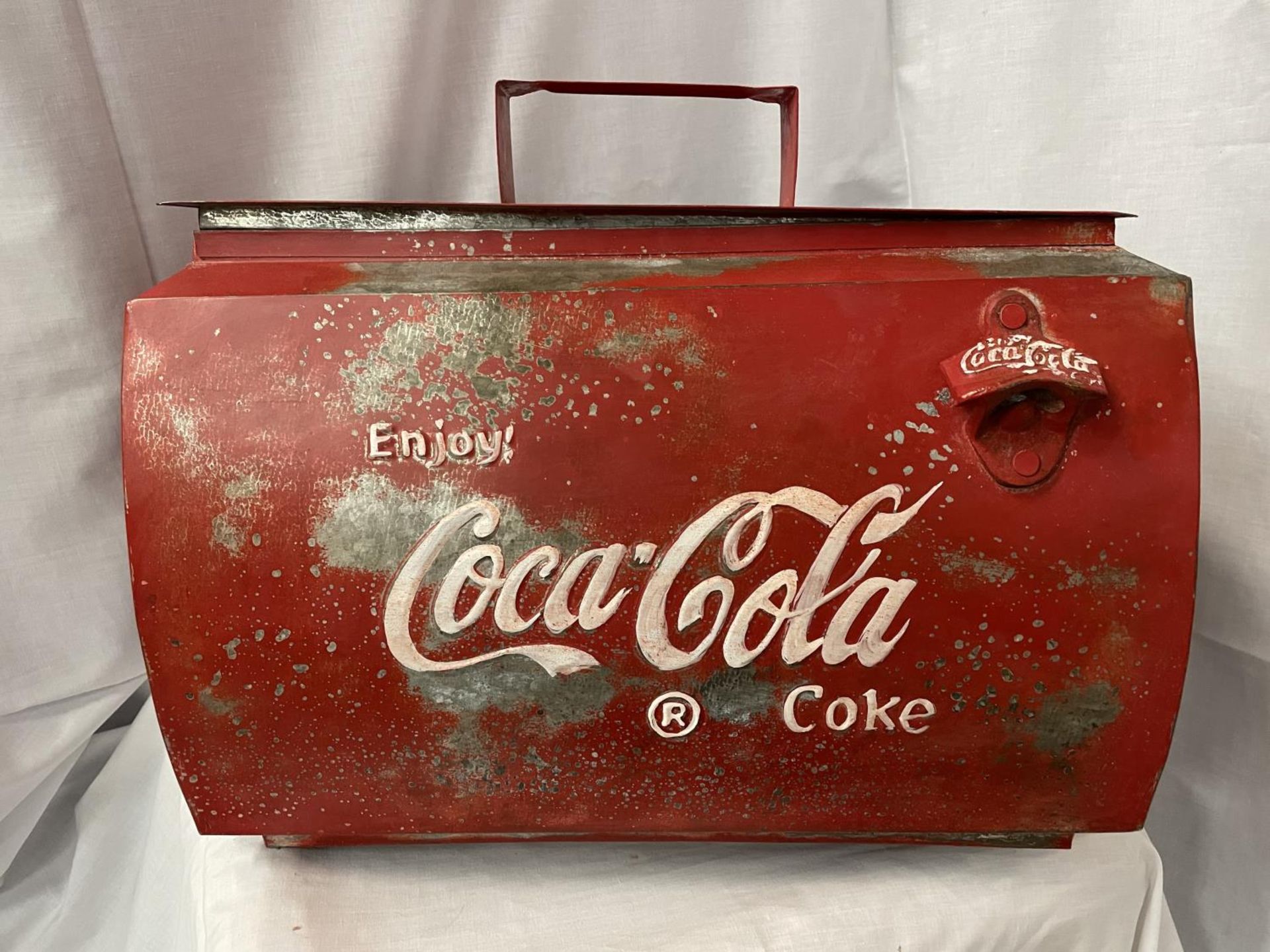 A LARGE METAL 'ENJOY COCA-COLA' LIDDED CONTAINER WITH HANDLE 44CM X 35CM