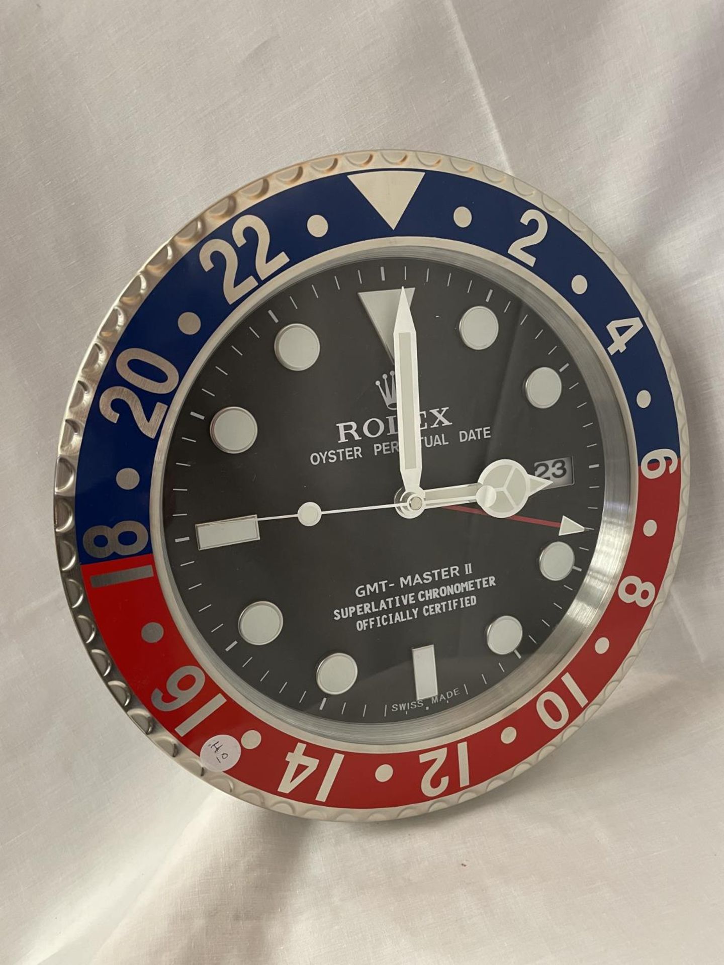 A LARGE DEALER'S WALL CLOCK