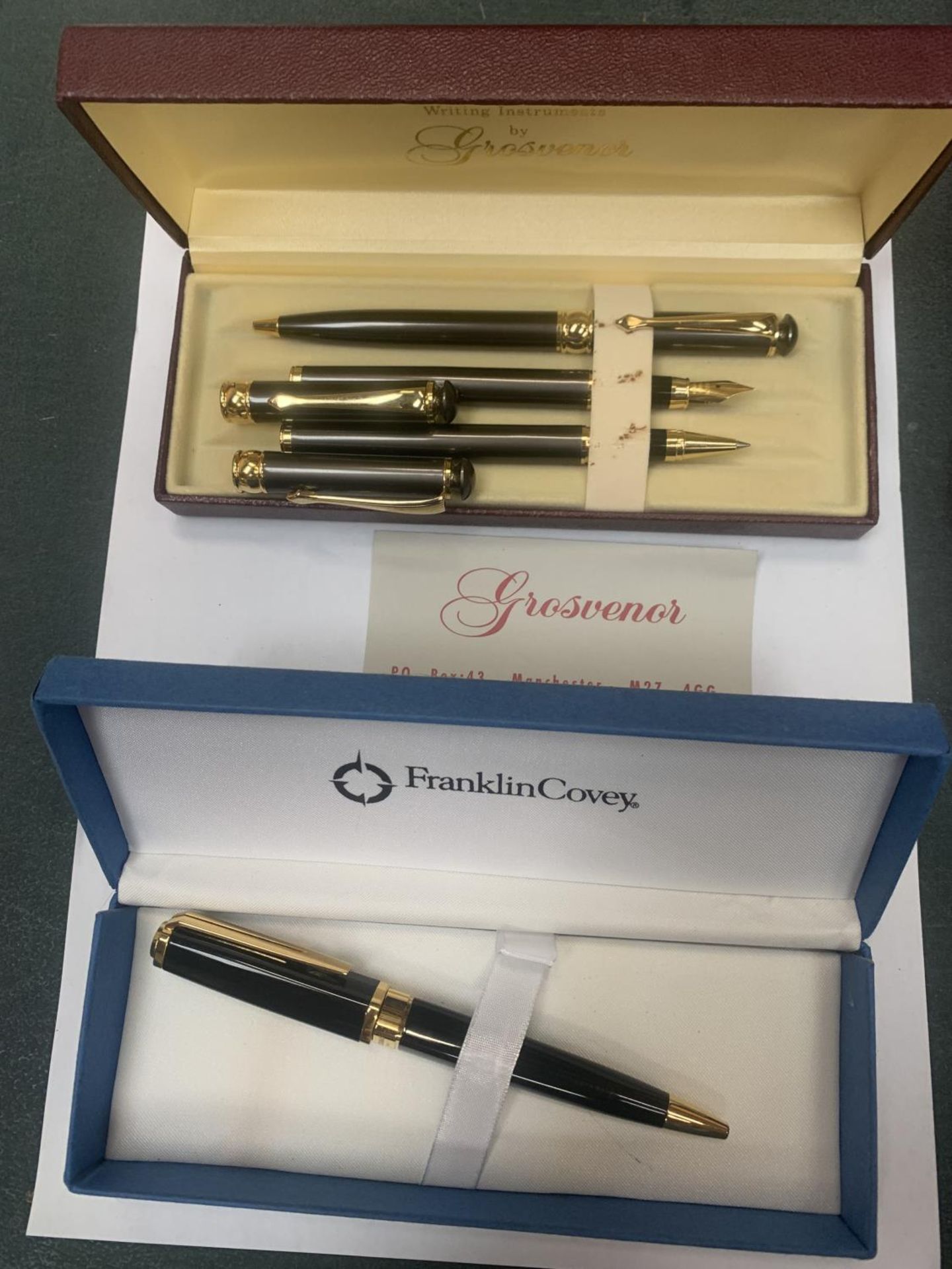 TWO BOXED PEN SETS TO INCLUDE A GROSVENOR THREE PEN TO INCLUDE TWO BIROS AND A FOUNTAIN PEN AND A