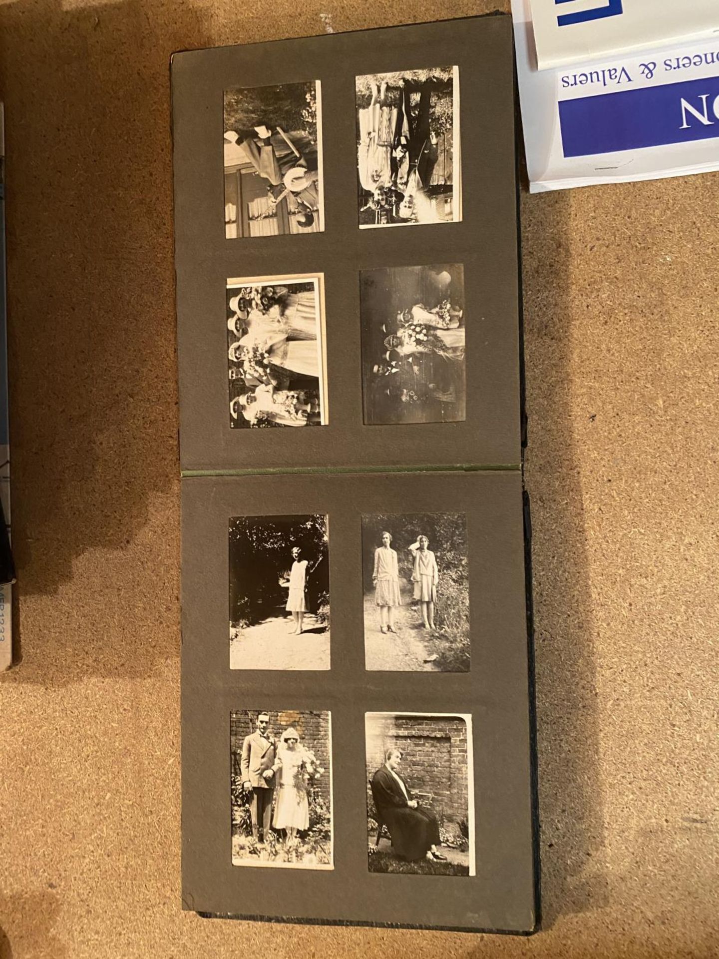 A SMALL VINTAGE PHOTO ALBUM CONTAINING BLACK AND WHITE IMAGES - Image 6 of 8