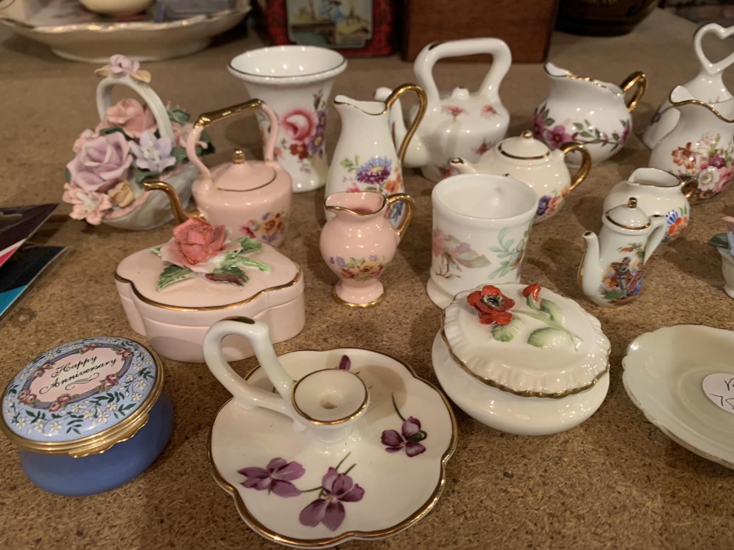 A SELECTION OF MINIATURE ORNAMENTS INCLUDING JUGS , CUPS AND SAUCERS , BASKET OF FLOWERS - Image 2 of 3