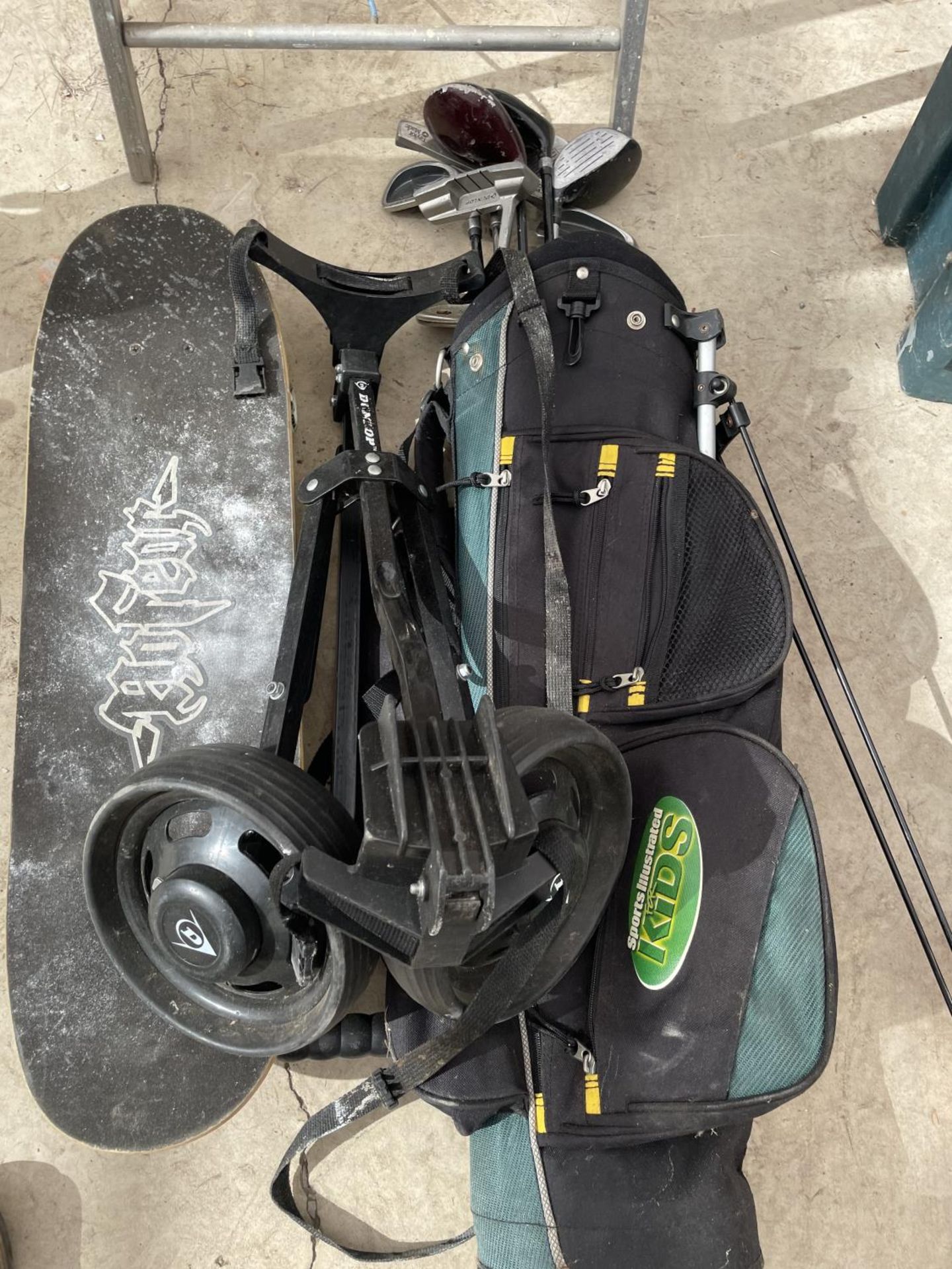 A SET OF CHILDRENS GOLF CLUBS A GOLF TROLLEY AND A SKATE BOARD - Image 2 of 2