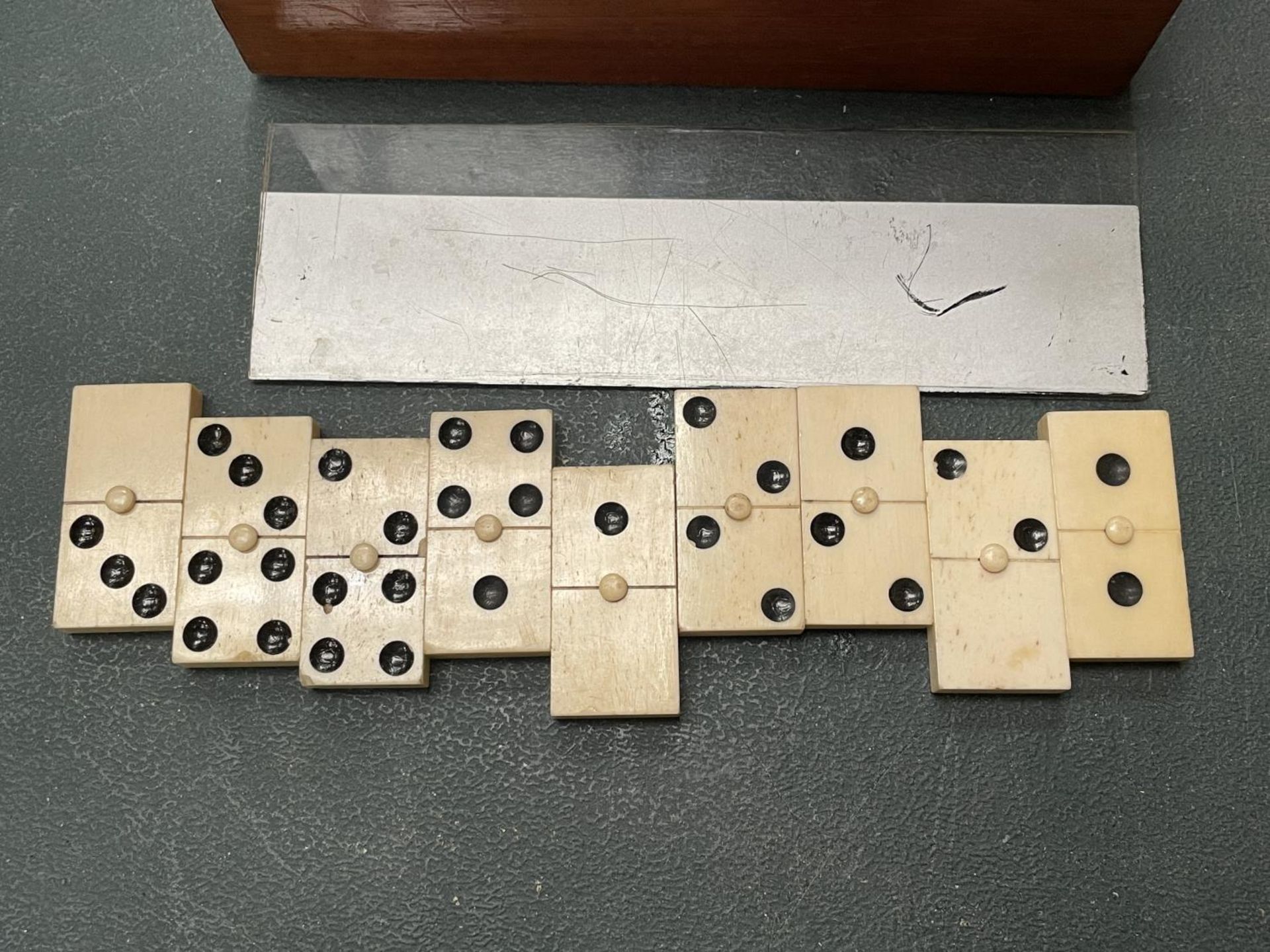 A WOODEN BOXED SET OF BONE DOMINOES - Image 2 of 3