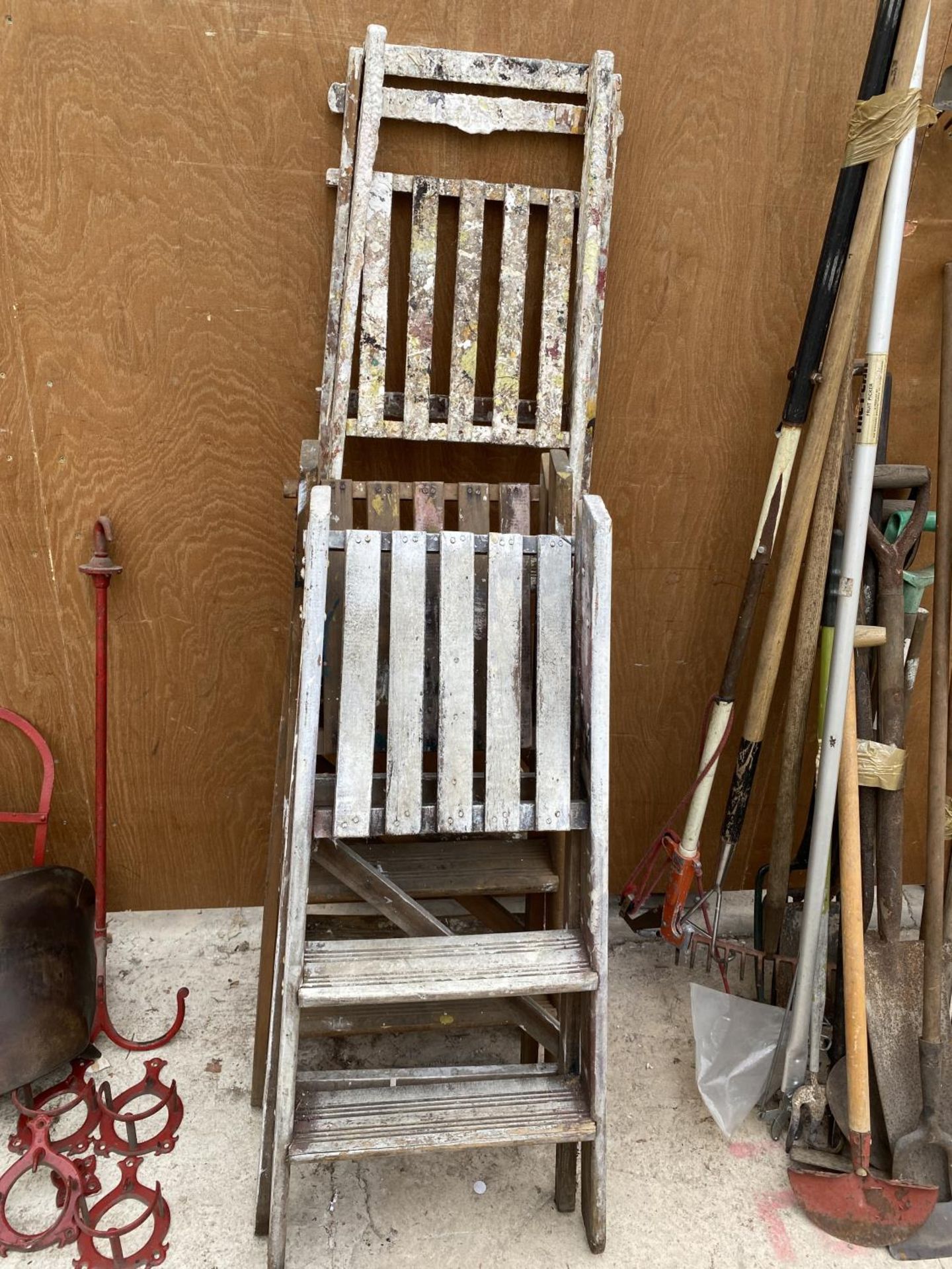 A VINTAGE FOUR RUNG WOODEN STEP LADDER AND TWO FURTHER TWO RUNG WOODEN STEP LADDERS