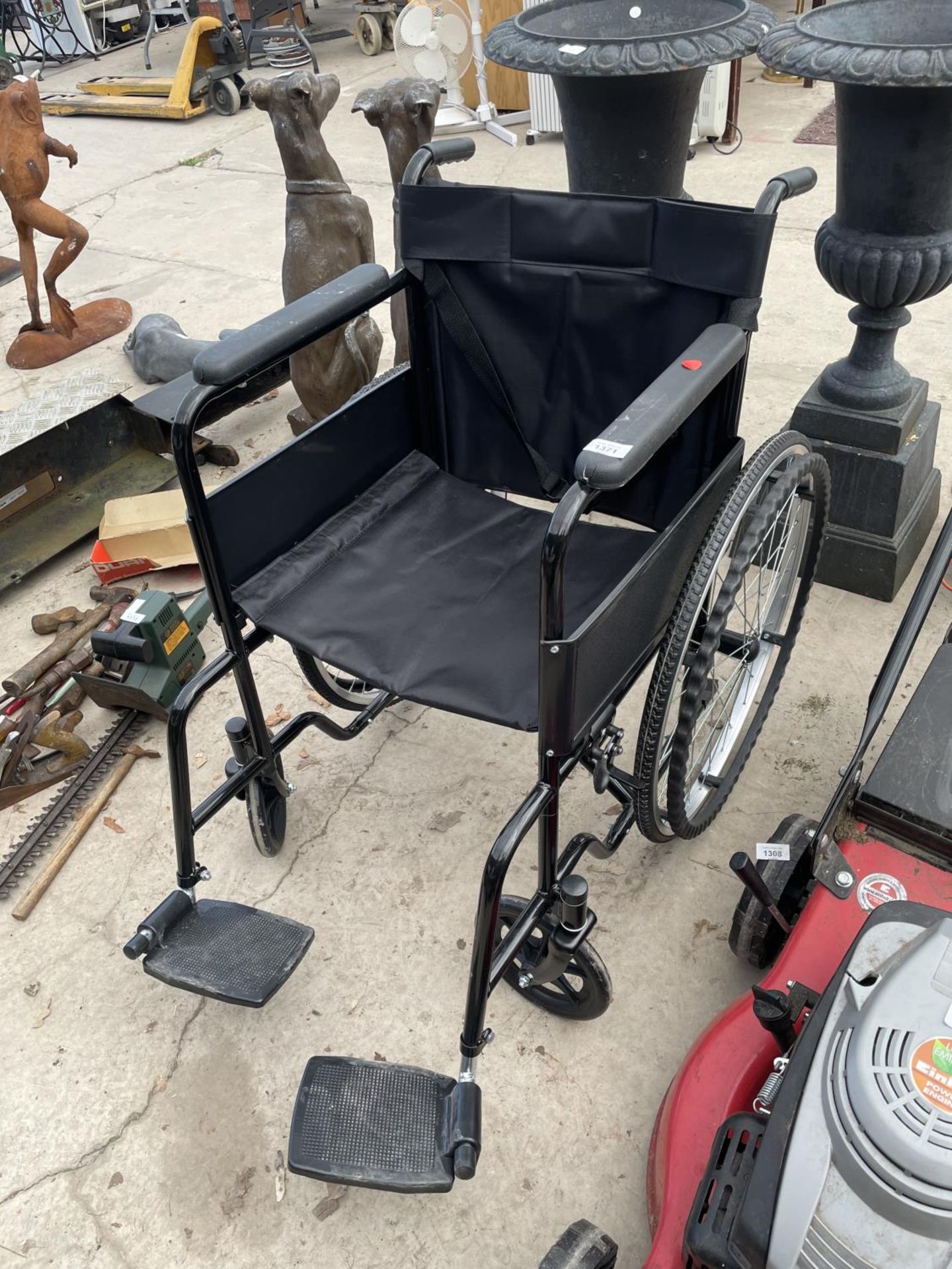 AN AS NEW ALL AID WHEEL CHAIR