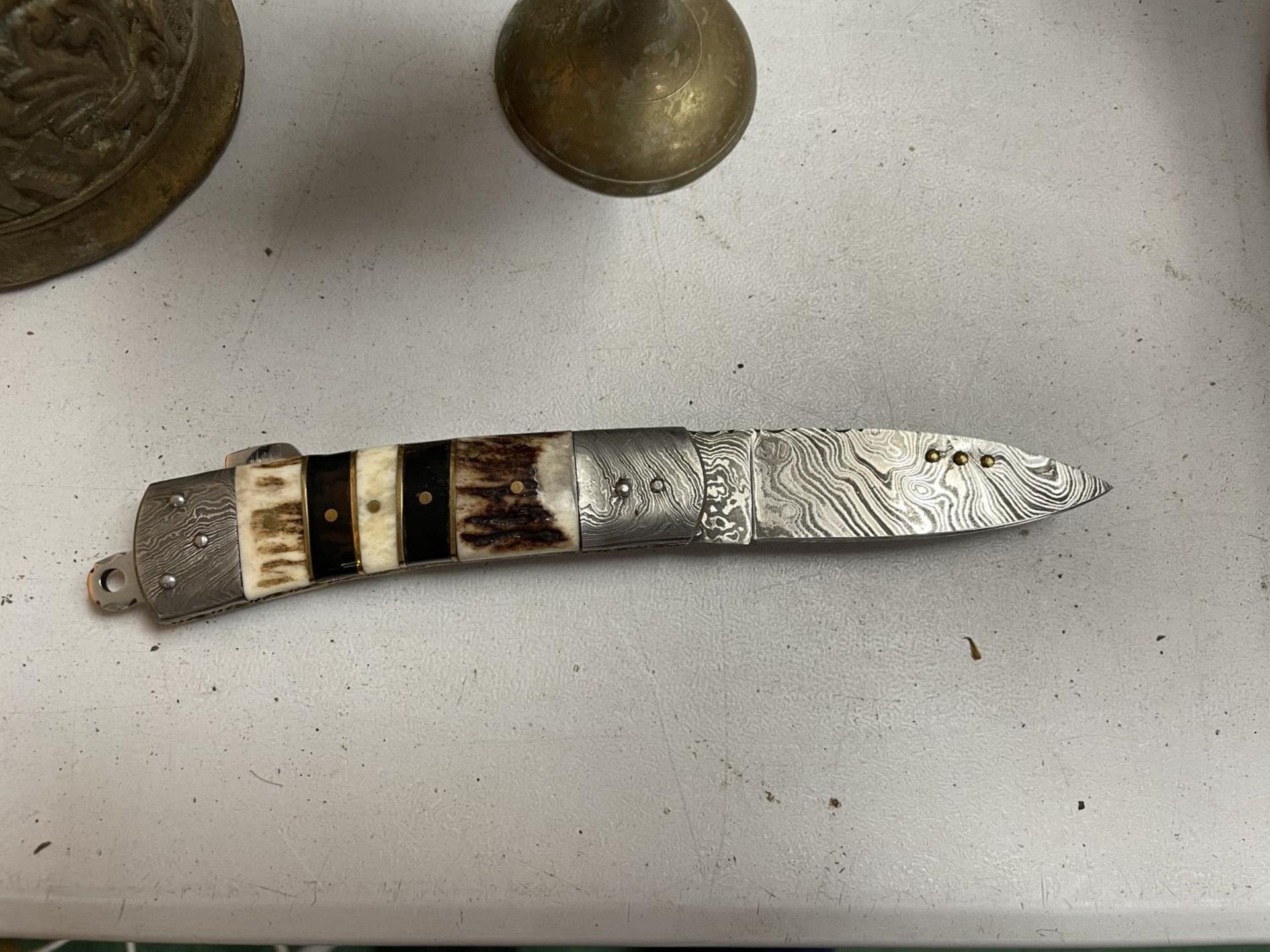 A DAMASCUS BLADED PERKIN FOLDING KNIFE