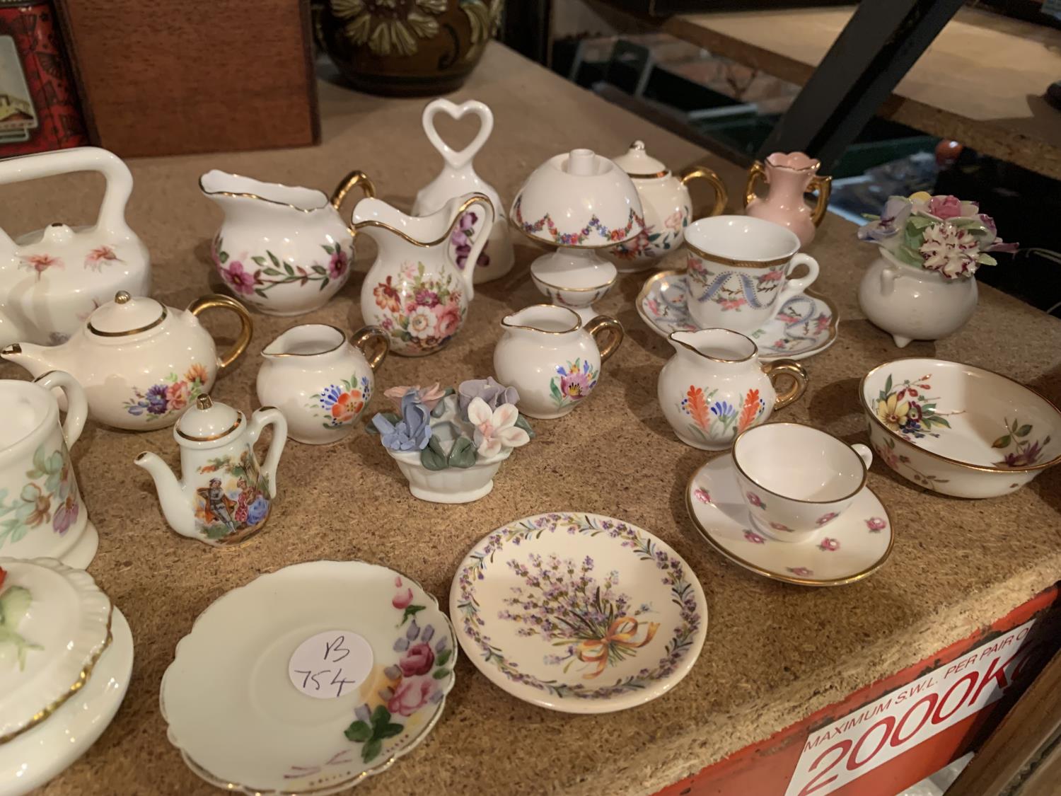 A SELECTION OF MINIATURE ORNAMENTS INCLUDING JUGS , CUPS AND SAUCERS , BASKET OF FLOWERS - Image 3 of 3