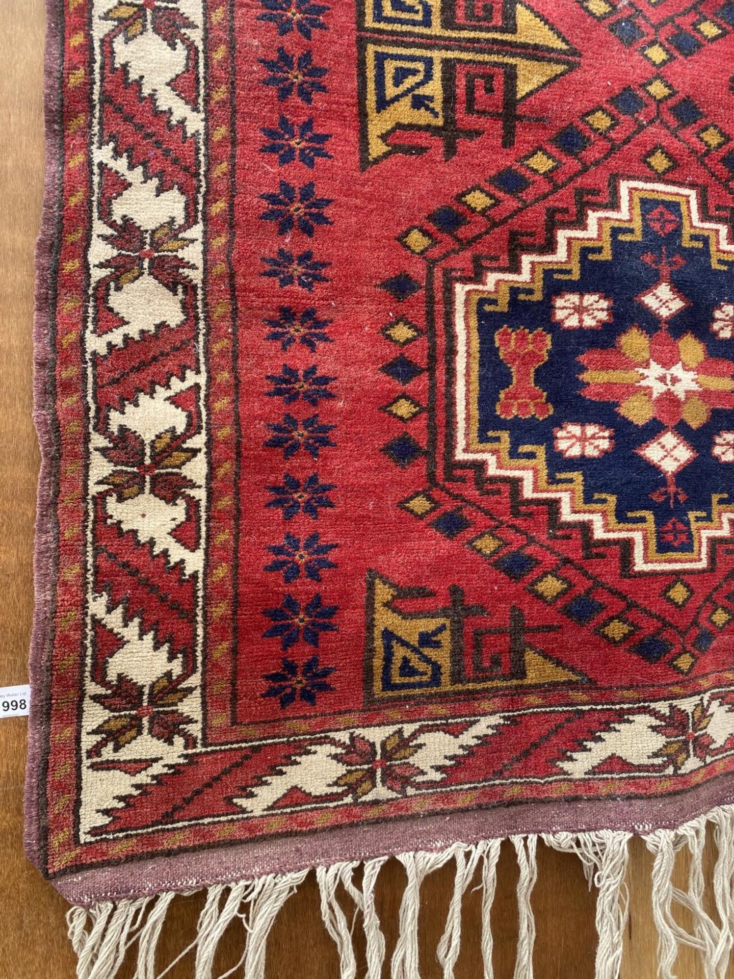 A RED PATTERNED RUG - Image 2 of 4