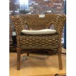 A CHILDS CURVED BACK WOVEN CHAIR
