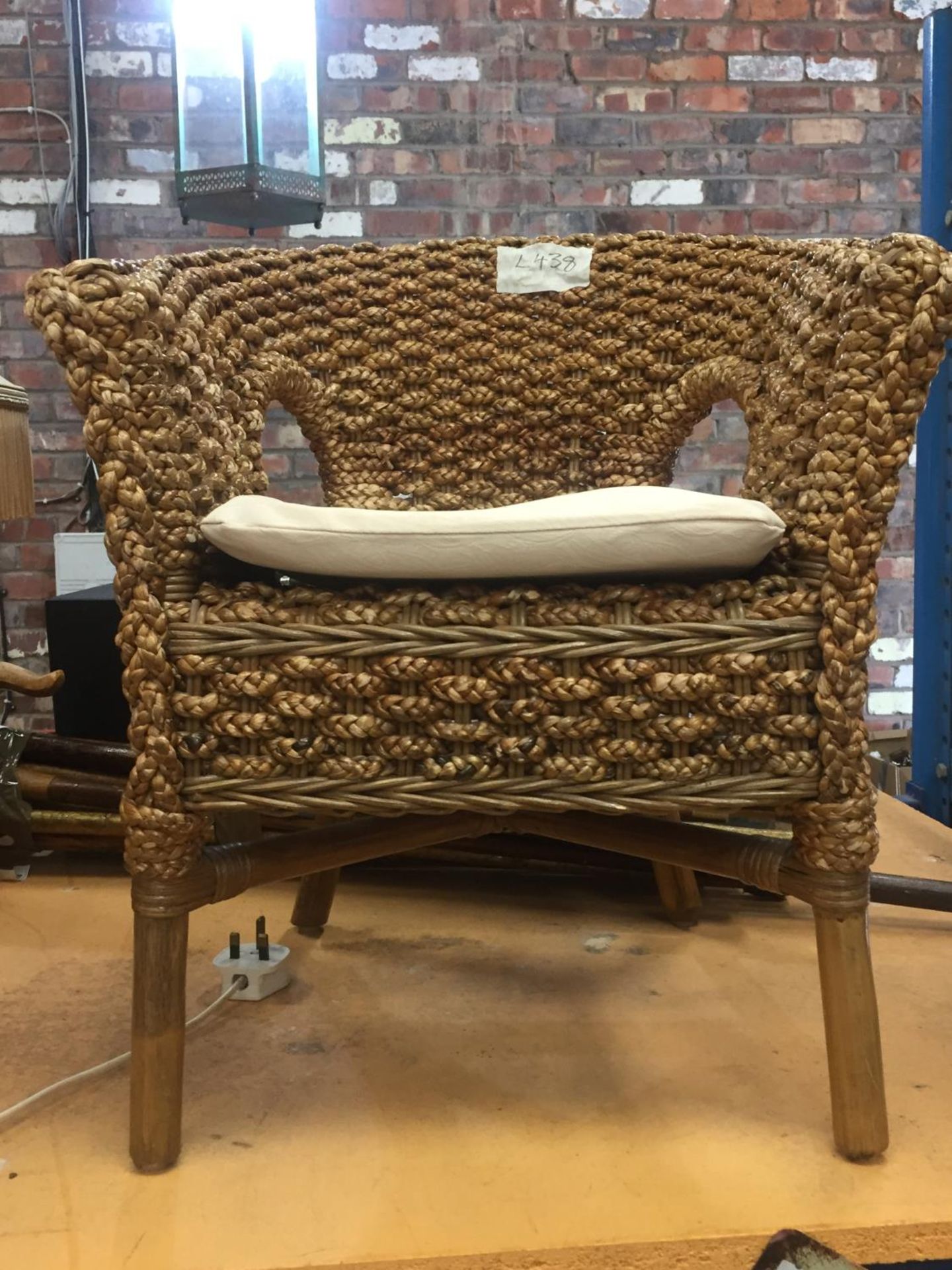 A CHILDS CURVED BACK WOVEN CHAIR