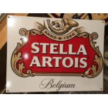 A TIN STELLA ARTOIS SIGN