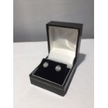 A PAIR OF 18 CARAT WHITE GOLD AND DIAMOND EARRINGS IN A PRESENTATION BOX