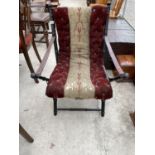 A VICTORIAN EBONISED FOLDING CAMPAIGN STYLE CHAIR WITH LEATHER ARM STRAPS