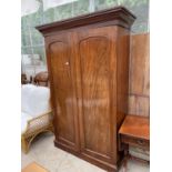 A VICTORIAN MAHOGANY TWO DOOR WARDROBE WITH FITTED INTERIOR