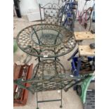 A DECORATIVE FLORAL DESIGN CAST METAL BISTRO SET WITH ROUND TABLE AND TWO CHAIRS