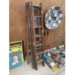 A VINTAGE FOUR RUNG WOODEN STEP LADDER AND A FURTHER 21 RUNG WOODEN EXTENDING LADDER