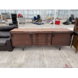 A RETRO TEAK SIDEBOARD ENCLOSING TWO SLIDING DOORS AND FOUR DRAWERS AND THREE FRIEZE DRAWERS, 89"