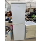 A WHITE CANDY UPRIGHT FRIDGE FREEZER BELIEVED IN WORKING ORDER BUT NO WARRANTY