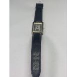 A RAYMOND WEIL GENEVE WRIST WATCH WITH A WHITE METAL RECTANGULAR FACE