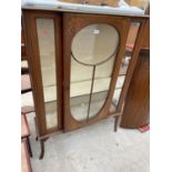 AN EDWARDIAN MAHOGANY AND INLAID DISPLAY CABINET WITH KICK-OUT LEGS, 43.5" WIDE