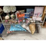 AN ASSORTMENT OF ITEMS TO INCLUDE BEAUTY PRODUCTS, ARTIFICIAL FLOWERS AND CUSHIONS ETC