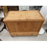 A MODERN PINE BLANKET CHEST, 39" WIDE, WITH DRAWER TO THE BASE
