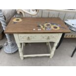 A PAINTED AND FLORAL DECORATED SINGLE DRAWER SIDE TABLE