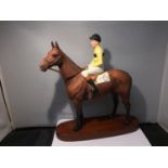 A BESWICK MODEL OF ARKLE AND PAT TAAFFE ON A WOODEN PLINTH