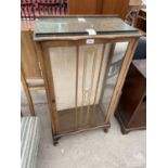 A SHINY WALNUT DISPLAY CABINET ON CABRIOLE LEGS, 22" WIDE